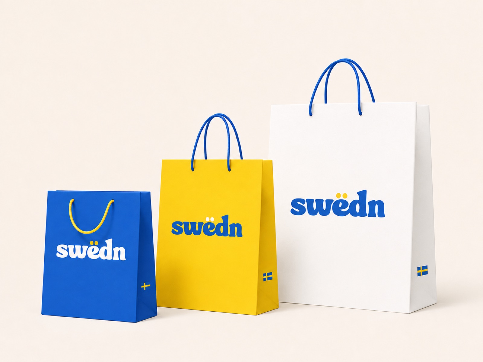 Three Swedn paper carrier bags in blue, yellow, and white, each with the swedn wordmark and a small Swedish flag near the base.